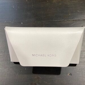 Michael Kors white glass case. Excellent condition. No glasses included